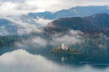 Fototapeta na wymiar Beautiful autumn landscape around Lake Bled with Pilgrimage Church of the Assumption of Maria