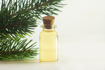 Essence of pine on table in beautiful glass jar