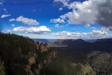 White clouds above three sisters, blue mountains, australia