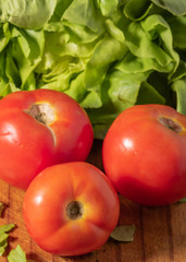 Detail shot of raw vegetables. Morrón, onion, lettuce, tomato. Colors and textures of vegetables.