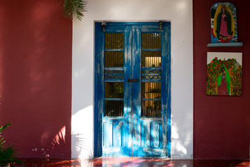 Blue door in Purple house, Colorful houses in Tulum, Mexico. 