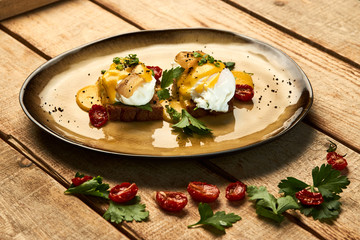 Healthy English breakfast, toasted bread with eggs benedict