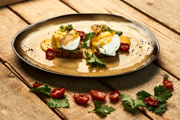 Healthy English breakfast, toasted bread with eggs benedict