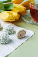 coconut candies and cup of tea