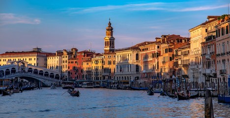 Italy beauty, evening gondolas near to Rialto bridge on Grand canal in Venice, Venezia