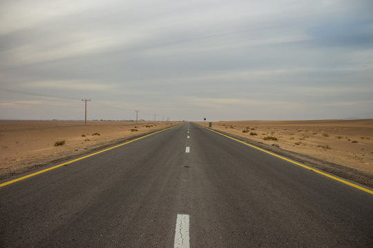 symmetry wallpaper photography of highway empty car road in USA Nevada desert nature wilderness environment, copy space, driving concept