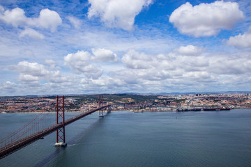 Fototapeta na wymiar Panoramic view of Ponte 25 de Abril, long bridge in Lisbon