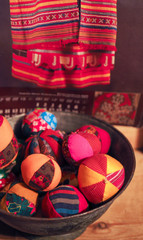 patchwork toy balls lie in the basket. Russian traditional
