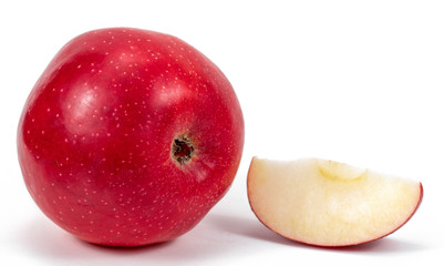 Fototapeta na wymiar One red apple and slice isolated on a white background