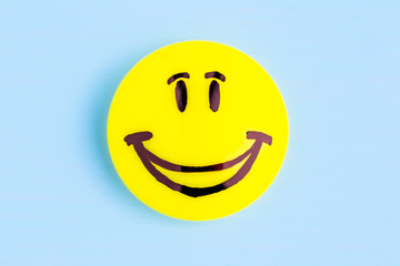 Smiling emoji. Оn blue background