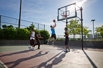 Men playing basketball 