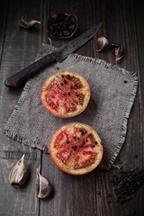 split tomatoes on rustic wood with natural light