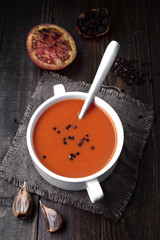 bowl of tomato sauce with spices on rustic wood with natural light