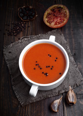 bowl of tomato sauce with spices on rustic wood with natural light