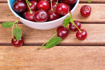 White plate of ripe cherries