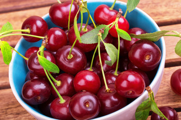 White plate of ripe cherries