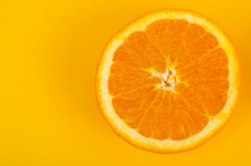 Two halves of cut orange, top view.