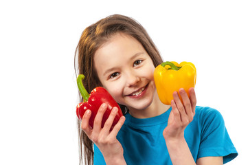 Happy smiling child with sweet pepper