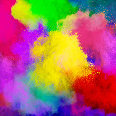 Colorful powder explosion on white background. Colored cloud. Colorful dust explode. Paint Holi.