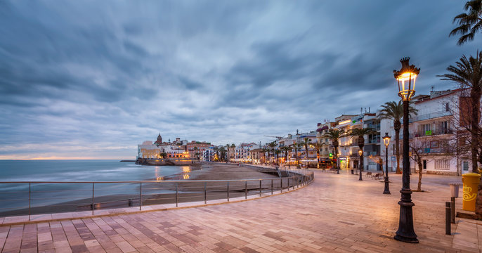 beach walk at sunset in playa san sebastian Sitges catalunya spain