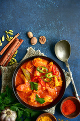 Chicken tikka masala - traditional dish of indian cuisine.Top view with copy space.