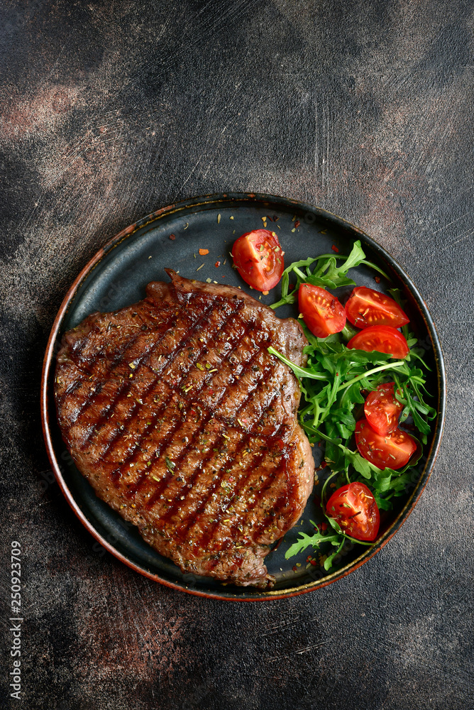 Wall mural Roasted organic rancho beef steak with vegetables salad.Top view with copy space. - Wall murals