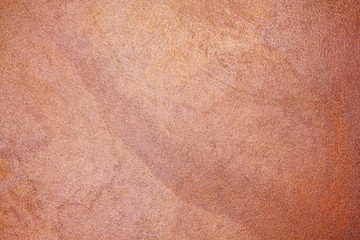 old textured wall with decorative plaster. stylized bronze, copper, metal.