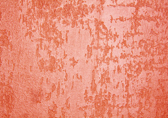 old textured wall with decorative plaster. stylized bronze, copper, metal.