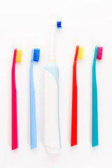 Manual and electric toothbrushes isolated on white background. Dental care