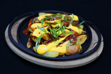 buffalo potato wedges with cheese sauce and jalapeno