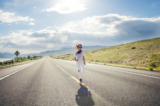 Woman running on road 