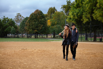 Young couple walking in park 