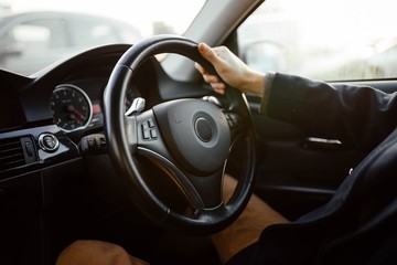 driving a modern car driver on a sunny day.