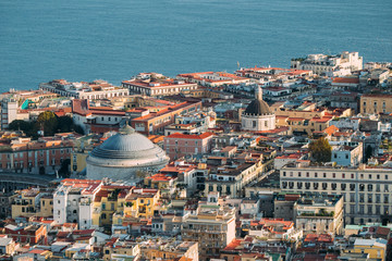 Naples, Italy. Top View Cityscape Skyline With Famous Landmarks And Part Of Gulf Of Naples In Sunny Day. Many Old Churches And Temples