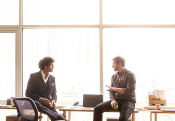 Office workers discussing in office 