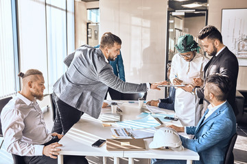 arab businessman is signing a contract during the conference. successful deal, project,