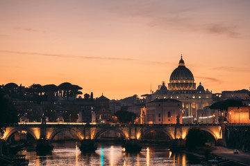 Fototapeta na wymiar Rome, Italy. Papal Basilica Of St. Peter In The Vatican And Aelian Bridge In Sunset Sunrise Time