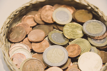 Basket full of euro coins. European Union currency