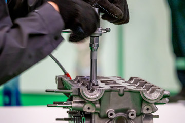 Automotive engine. Motor car. Locksmith repairs the engine. Engine service. Drive technology. Motor production. Auto industry. Engineering.