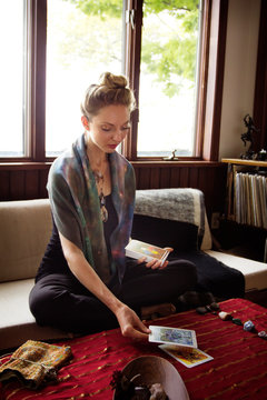 Female fortune teller reading tarot cards 