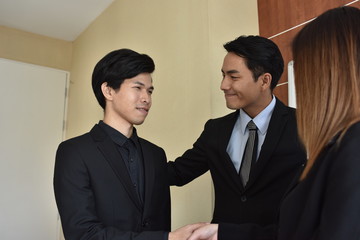 A group of young business people are meeting and having fun talking. And sometimes stressful