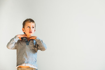 Child undressing before going to sleep, alone, learning to be independent.