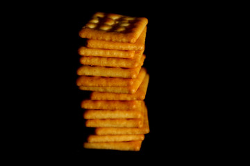 Crackers biscuit background / A cracker is a flat, dry baked food typically made with flour. 