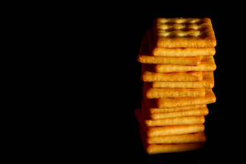 Crackers biscuit background / A cracker is a flat, dry baked food typically made with flour. 