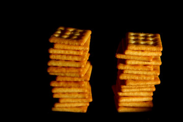 Crackers biscuit background / A cracker is a flat, dry baked food typically made with flour. 