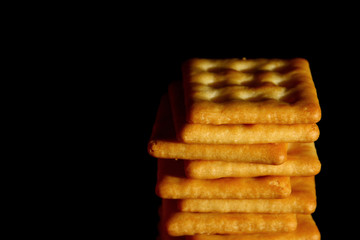Crackers biscuit background / A cracker is a flat, dry baked food typically made with flour. 