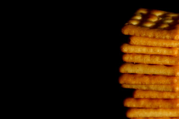 Crackers biscuit background / A cracker is a flat, dry baked food typically made with flour. 