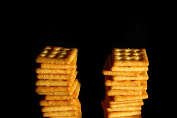 Crackers biscuit background / A cracker is a flat, dry baked food typically made with flour. 