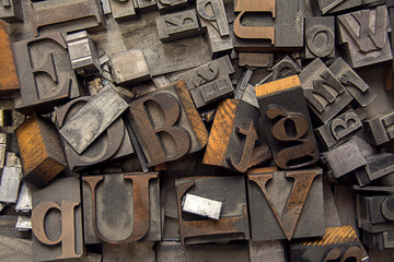 alphabet letter press background with old type lettering