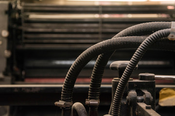 old rusty pipes in an antique printing press